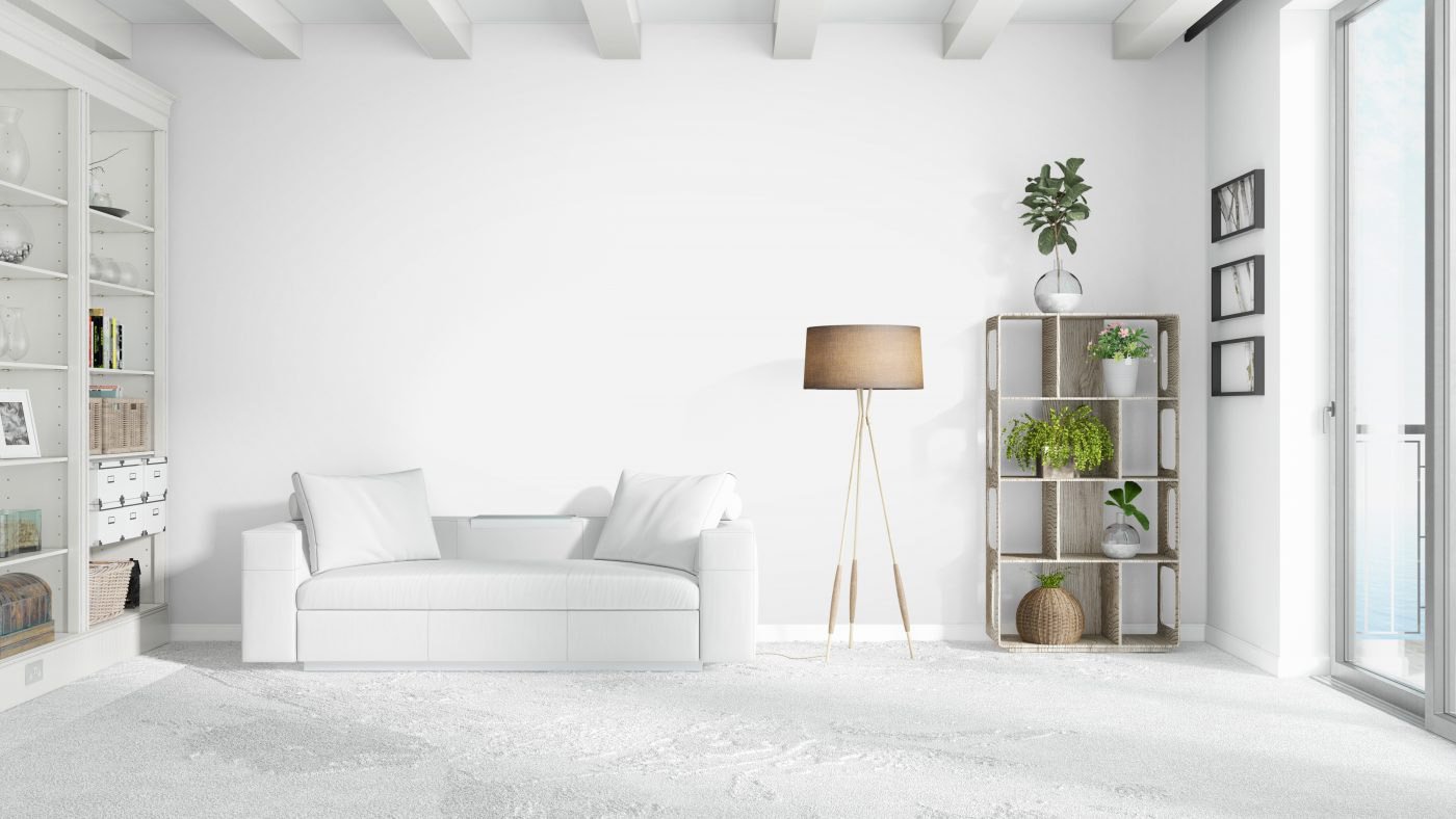 A bright living room with white sofa and shelf